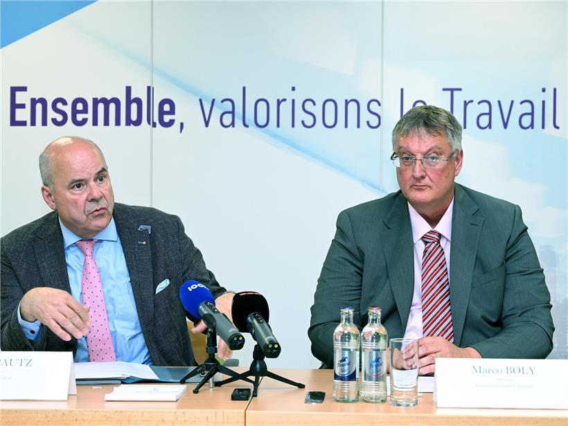 Arbeitsminister Marc Spautz und ITM-Direktor Marco Boly diskutieren pädagogische Ansätze gegen arbeitsrechtliche Verstöße.