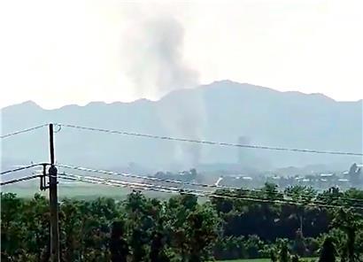Blick aus der südkoreanischen Stadt Paju auf die nordkoreanischen Grenzstadt Kaesong, aus der Rauch aufsteigt
