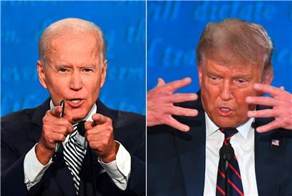(COMBO) This combination of pictures created on September 29, 2020 shows Democratic Presidential candidate and former US Vice President Joe Biden (L) and US President Donald Trump speaking during the first presidential debate at the Case Western Reserve University and Cleveland Clinic in Cleveland, Ohio on September 29, 2020. (Photos by Jim WATSON and SAUL…
