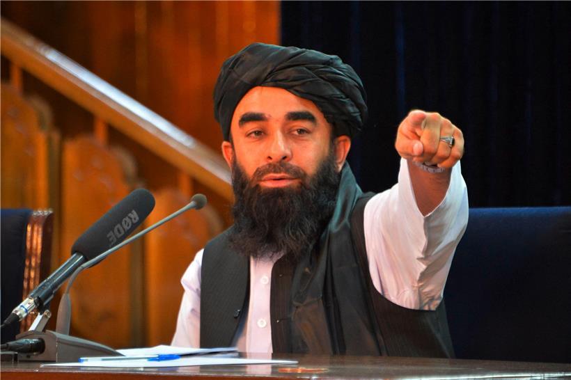 Die Taliban geben sich über ihren Pressesprecher Zabihullah Mujahid als moderat aus – doch die UN berichten von Massenhinrichtungen
