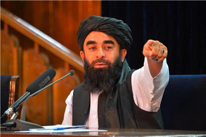 Die Taliban geben sich über ihren Pressesprecher Zabihullah Mujahid als moderat aus – doch die UN berichten von Massenhinrichtungen

