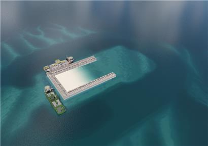 Die Umrisse der künstlichen Insel werden mit Betonkästen geformt. Anschließend wird die Insel angehoben und für den Bau der elektrischen Infrastruktur vorbereitet.
