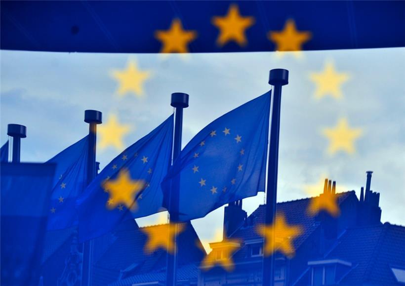 European flags are reflected at the entrance of the Berlaymont building of the EU Commission in Brussels
