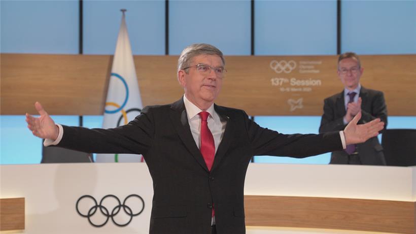 IOC-Präsident Thomas Bach und Emmanuel Macron versuchen trotz der großen Herausforderungen, Zuversicht und Vorfreude zu verkörpern
