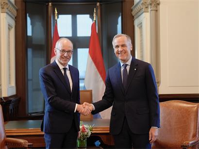 Luc Frieden und Mark Carney im Gespräch in Ottawa, Februar 2024, Thema finanzielle Stärke und Abschreckung