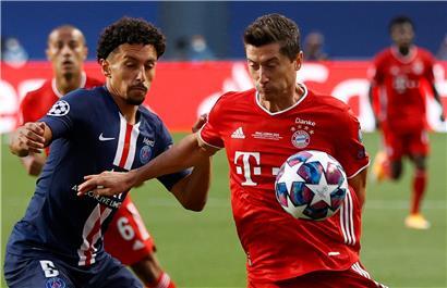 Marquinhos (PSG) und Robert Lewandowski (Bayern) kämpfen um den Ball
