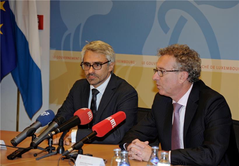 Pascal Saint-Amans (l.), OECD-Direktor für Steuerangelegenheiten, und der Luxemburger Finanzminister Pierre Gramegna (r.)
