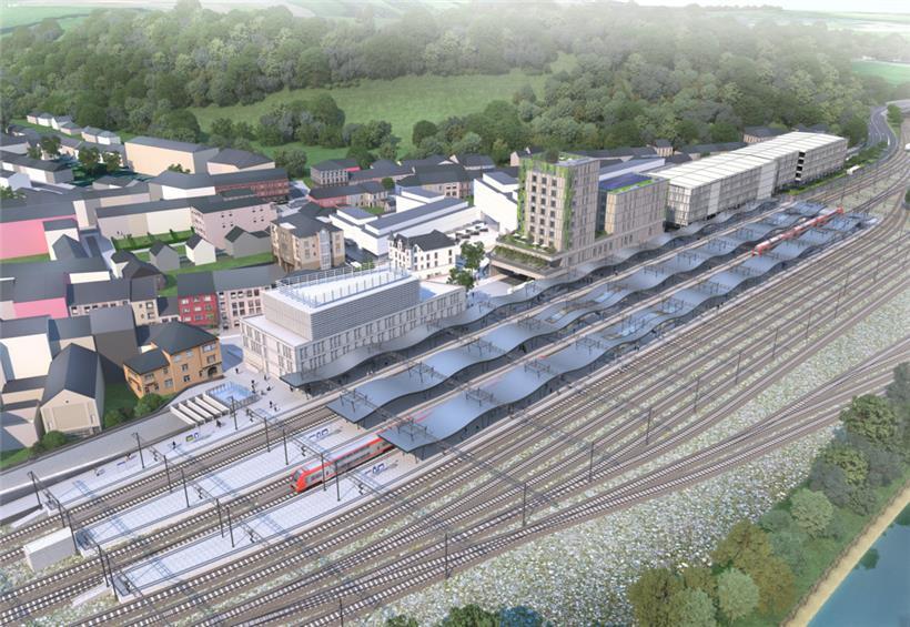 So soll das Bahnhofsviertel später aussehen: Im Vordergrund (l.) ist das neue Bahnhofsgebäude, in das auch das neue Polizeikommissariat integriert wird, zu sehen. Rechts daneben sieht man die Jugendherberge und das benachbarte Verwaltungsgebäude, die 2028 bezugsfertig sein sollen. Weiter rechts erkennt man das geplante Parkhaus.
