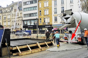 Hoppla! Arbeiter verteilen Beton mitten auf der Escher rue de la Libération