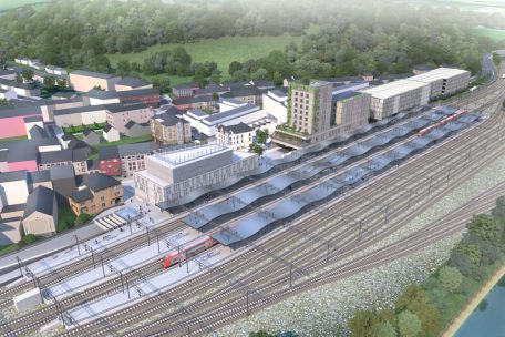 So soll das Bahnhofsviertel später aussehen: Im Vordergrund (l.) ist das neue Bahnhofsgebäude, in das auch das neue Polizeikommissariat integriert wird, zu sehen. Rechts daneben sieht man die Jugendherberge und das benachbarte Verwaltungsgebäude, die 2028 bezugsfertig sein sollen. Weiter rechts erkennt man das geplante Parkhaus.